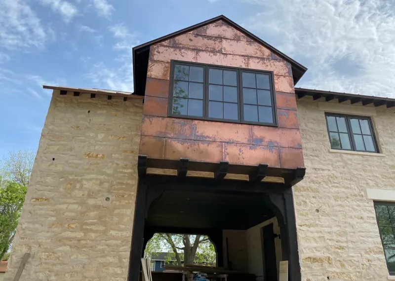 Copper metal panel facade on a stone building for Skylight Installation in Ojai