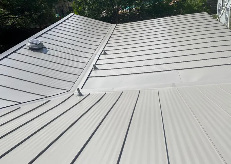 Solar attic fan installed on a metal roof for Roof Ventilation in Ojai
